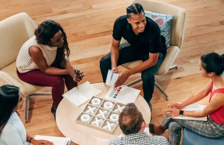 The Adaptive Ecosystem event promotional image showing people in a workshop setting.